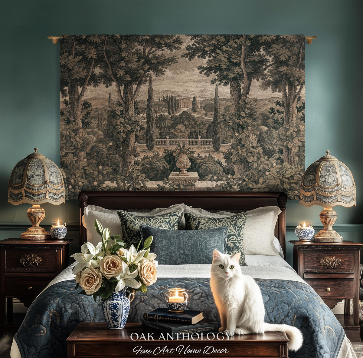 May include: A wall tapestry featuring a landscape scene with trees and a garden, hung above a bed with two lamps, a bouquet of roses and lilies in a blue and white vase, and a white cat. The text OAK ANTHOLOGY Fine Art Home Decor is visible.